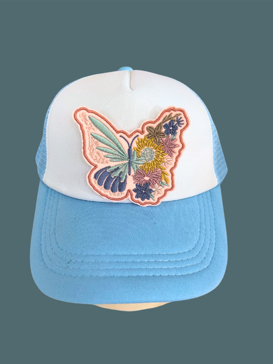 Handmade Butterfly and Floral patch with intricate embroidery on a white background.