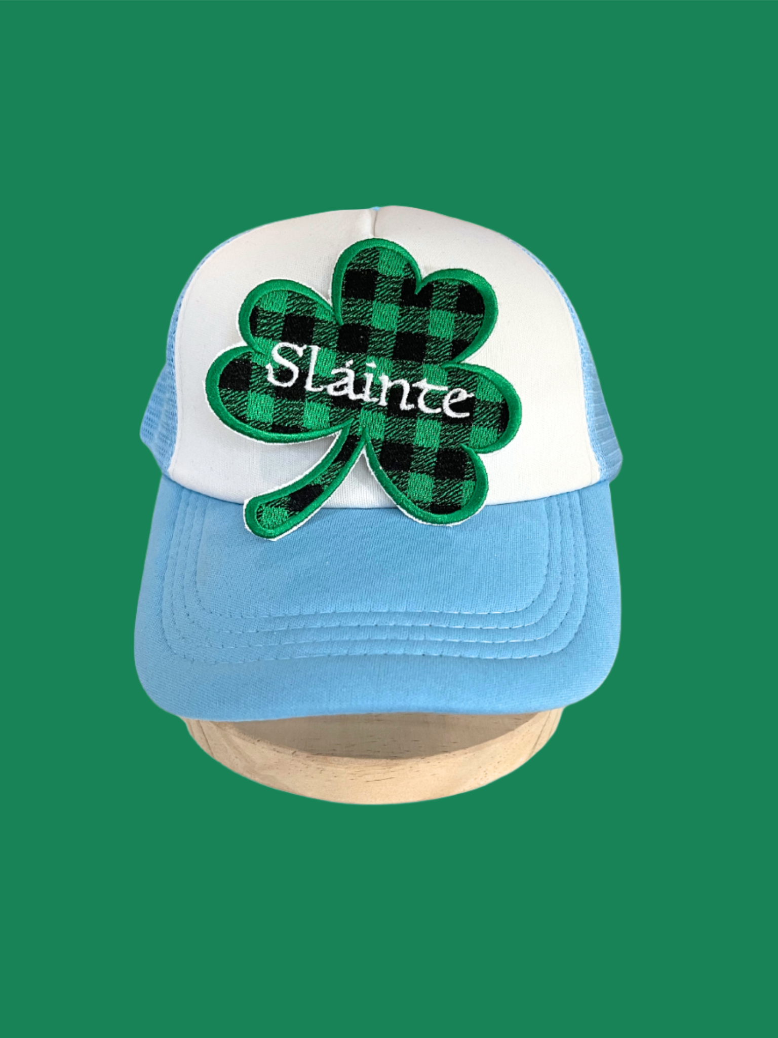 Handmade Sláinte Shamrock patch with green plaid design and white script embroidery.