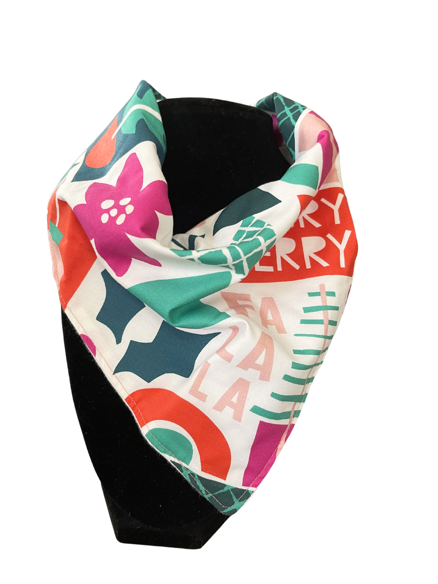Festive reversible bib-dana for babies with holiday-themed pattern and adjustable snap closure.