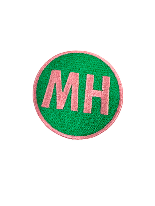 MH PINK embroidery on green patch.