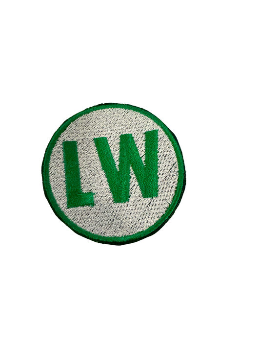 LW GREEN embroidered patch on white background.