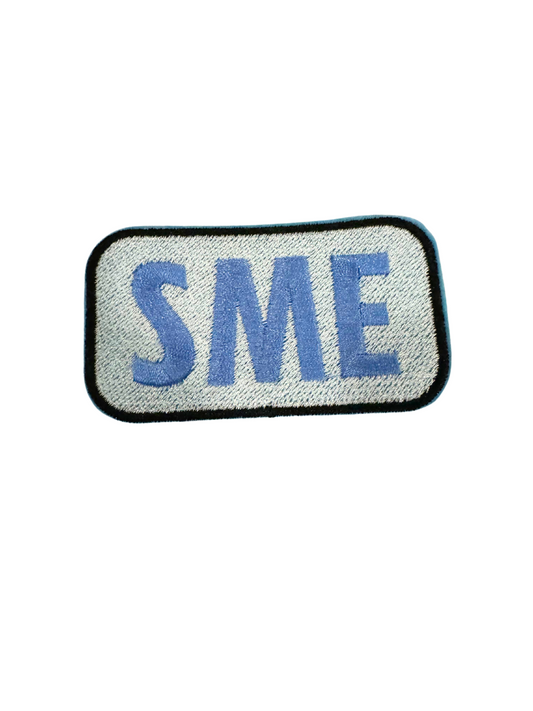 SME patch blue on white fabric background