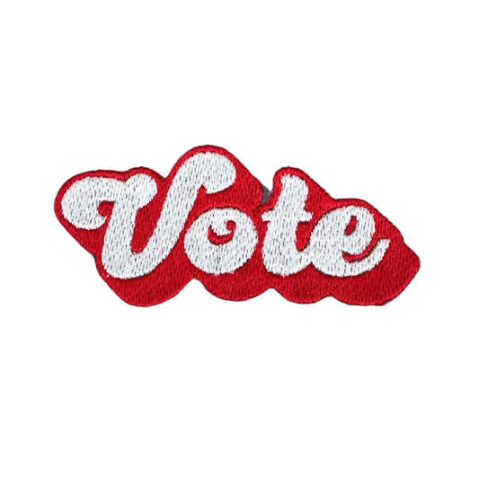 Handmade "Vote" patch in red and white lettering for custom hats and accessories.