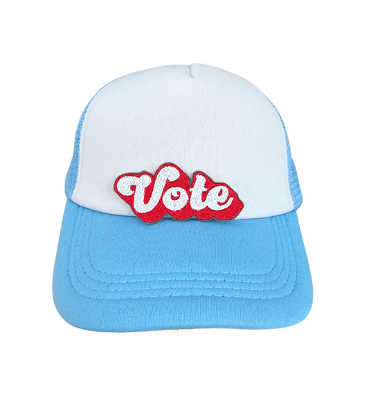 Handmade "Vote" patch in red and white with a bold, stylish design.