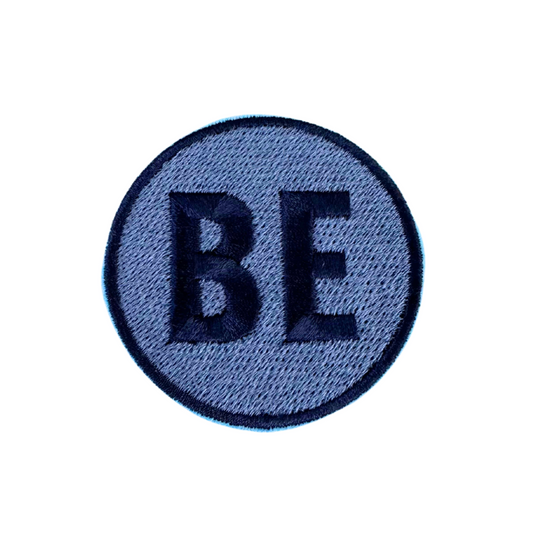 Belinder Elementary "BE" patch in blue and navy, handmade for artistic school spirit.