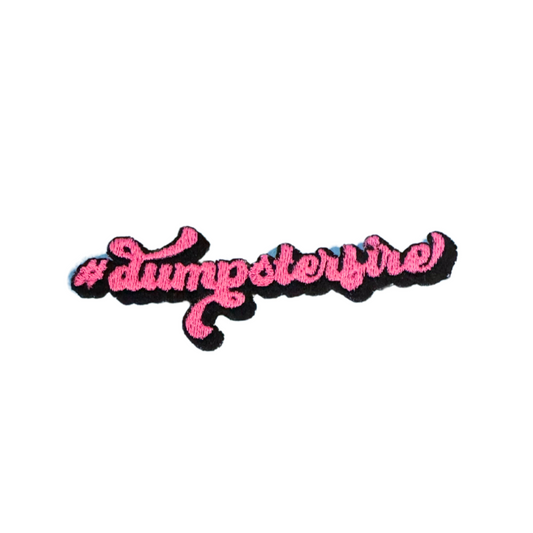 #Dumpsterfire handmade patch in pink and black script letters.