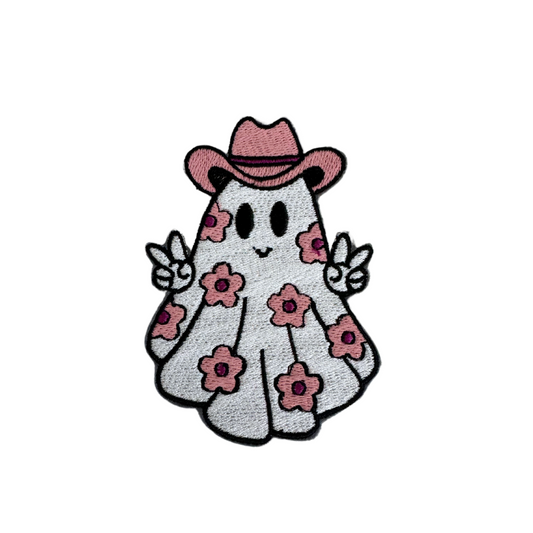 Pink cowboy ghost patch with floral design and peace signs.