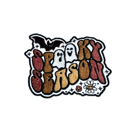 Spooky Season Retro Patch with bats, ghosts, and flowers in groovy Halloween design.