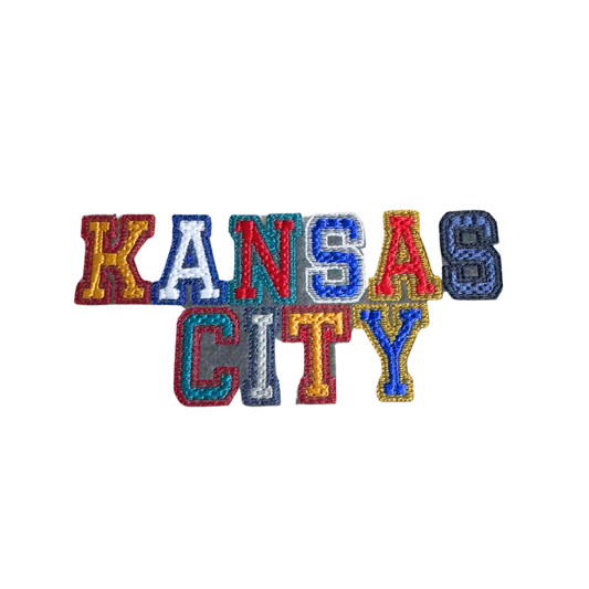 Retro Kansas City patch with vibrant multicolored vintage lettering.
