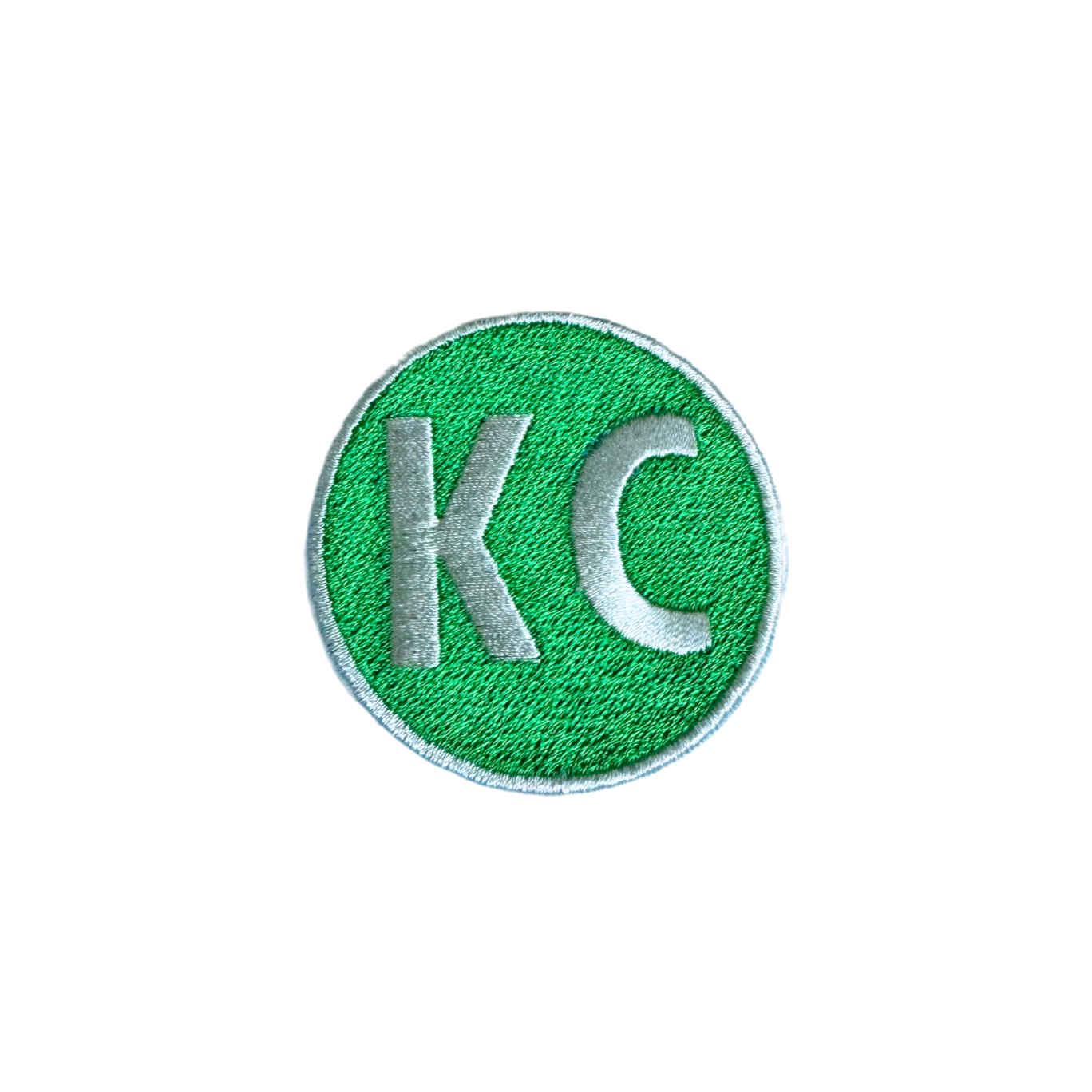 Kansas City Irish Green KC Patch with bold letters on a green background.