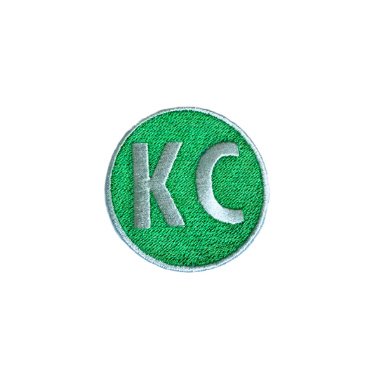 Kansas City Irish Green KC Patch with bold letters on a green background.