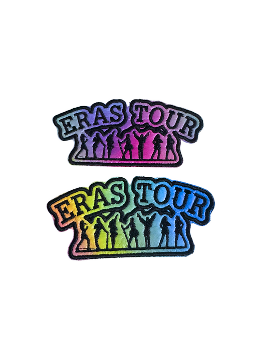 Eras Tour iron-on patch featuring vibrant Taylor Swift silhouettes and "ERAS TOUR" text.