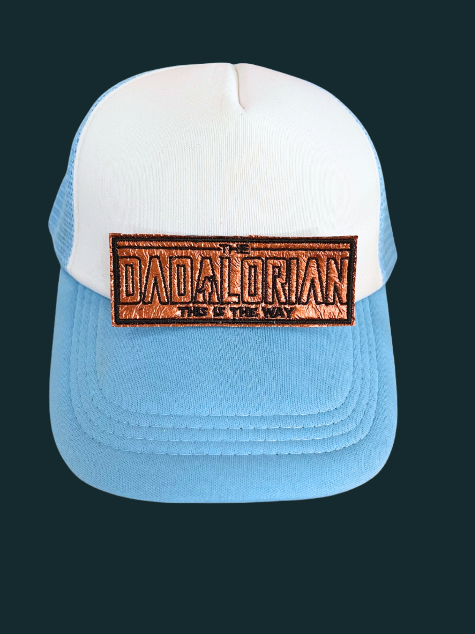 Handmade Dadalorian patch with bold lettering and a Mandalorian-inspired design in copper and black.