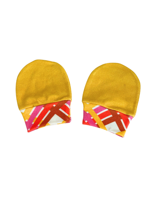 Luxurious baby scratch mittens in gold with vibrant geometric patterns, organic cotton knit, newborn to 6 months.