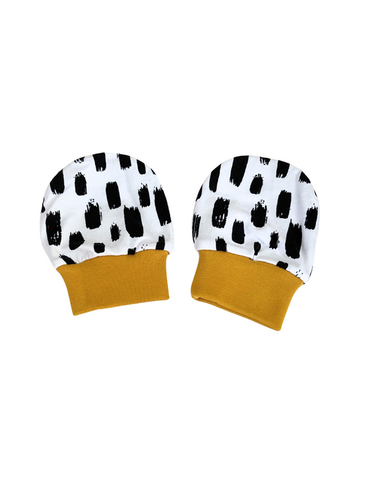 Elegant baby scratch mittens with black and white brush strokes, mustard cuffs, organic cotton, newborn to 6 months.