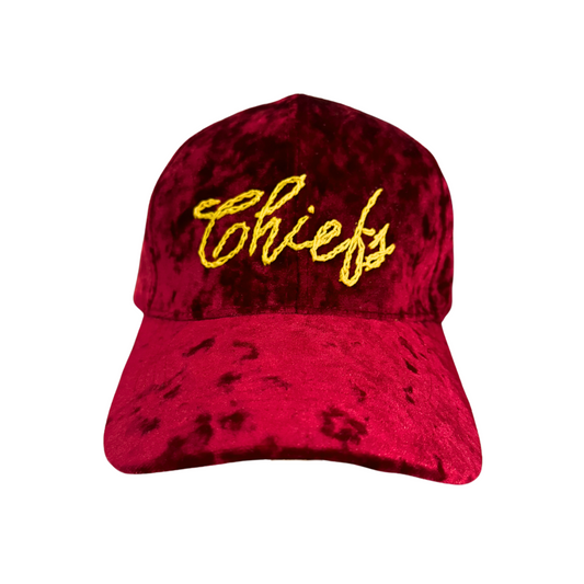 Crushed-velvet "Chiefs" hand-embroidered adjustable hat in deep red with golden script.