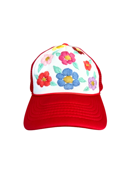 Red and white floral trucker hat with hand-embroidered colorful flowers.