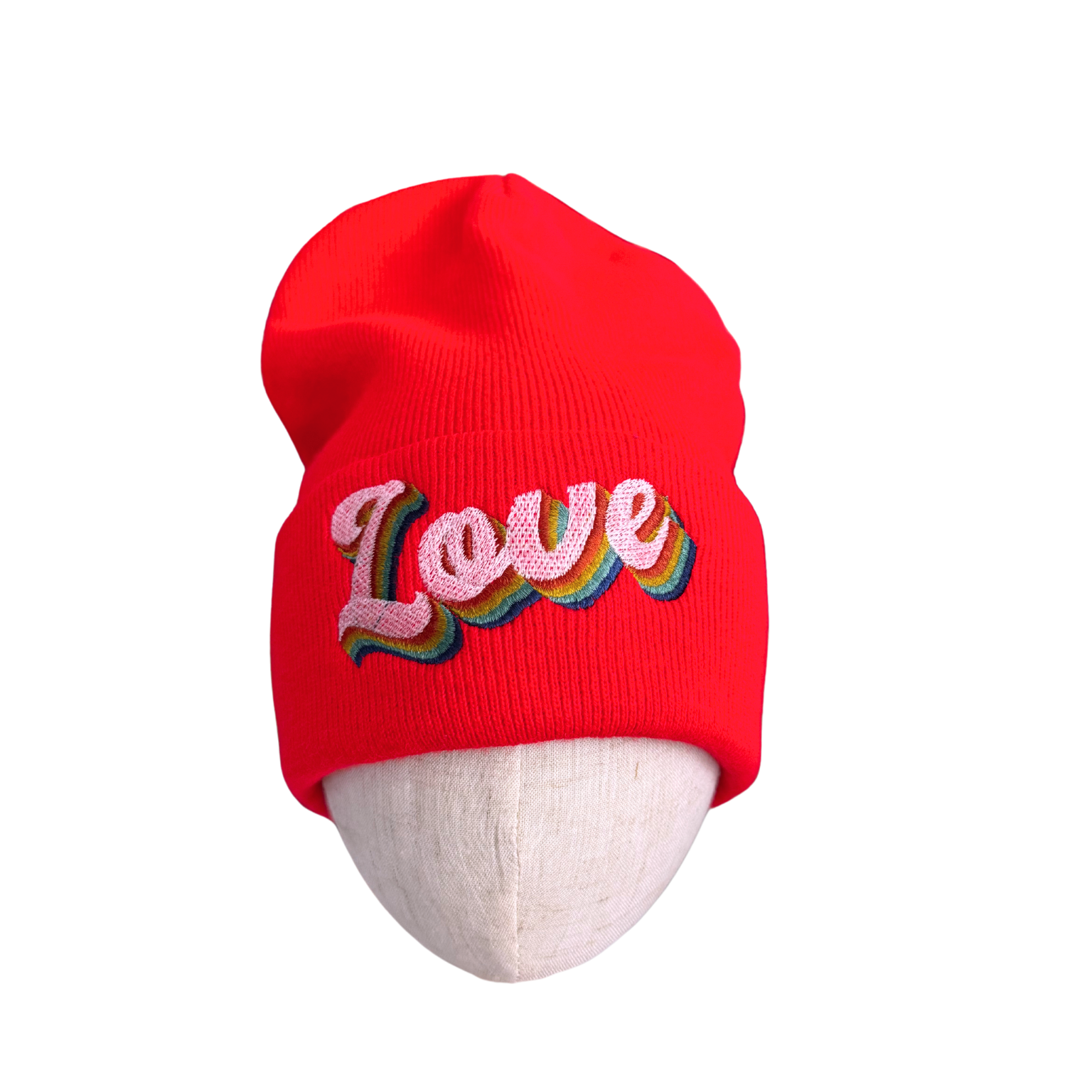 Red beanie with "Love" embroidered in rainbow colors, adult-size winter hat.