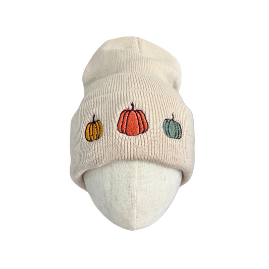 Adult triple pumpkin embroidered beanie in beige with autumn-colored pumpkins.