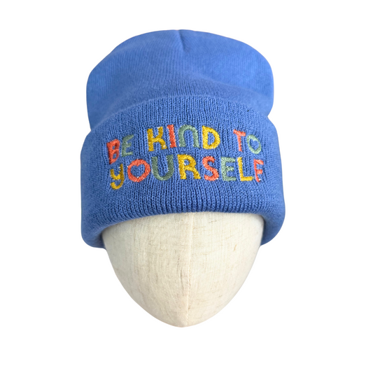 Blue embroidered beanie with "Be Kind to Yourself" positive affirmation.
