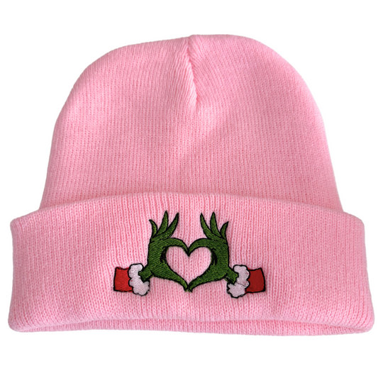 Pink beanie with Grinch heart hands embroidery design inspired by Travis Kelce and Taylor Swift.

