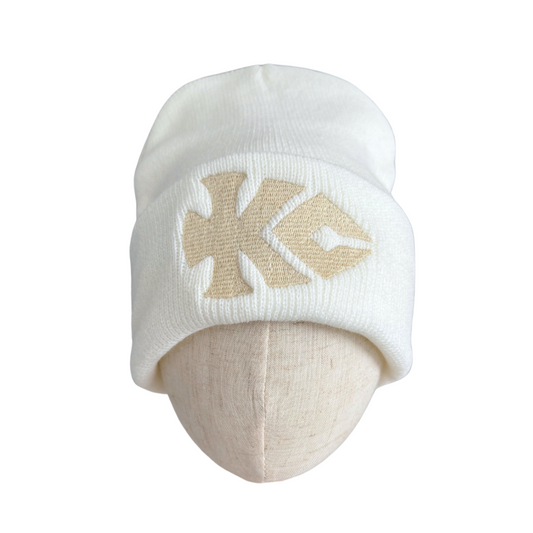 Winter white beanie with straw-toned KC arrowhead logo embroidery.