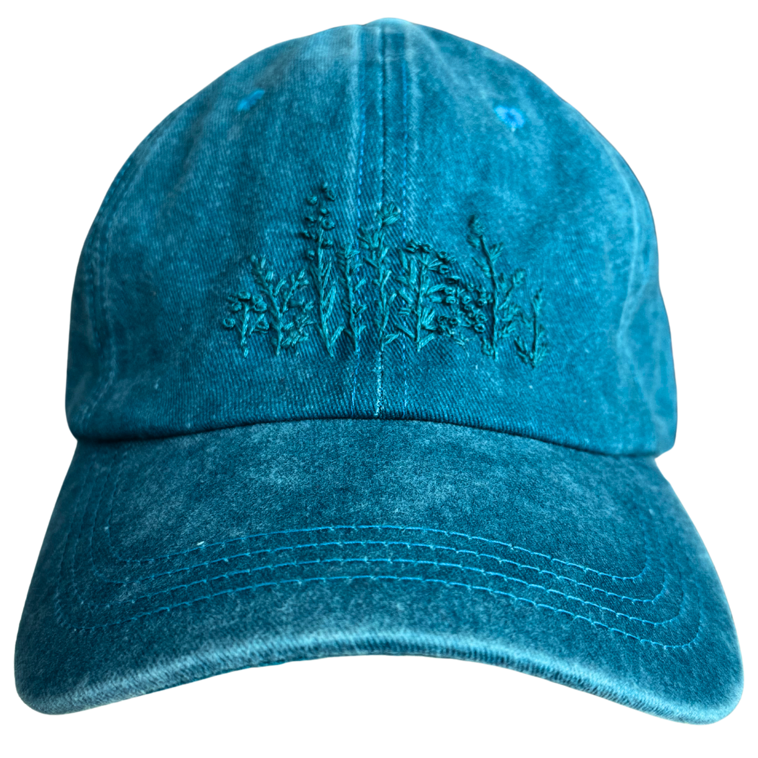 Teal monochrome floral hat with hand-embroidered wildflower design.