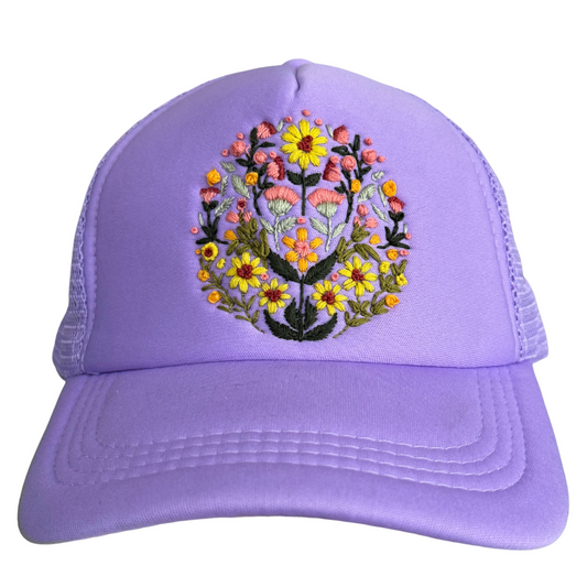 Lavender floral hat with hand-embroidered blooming garden design.