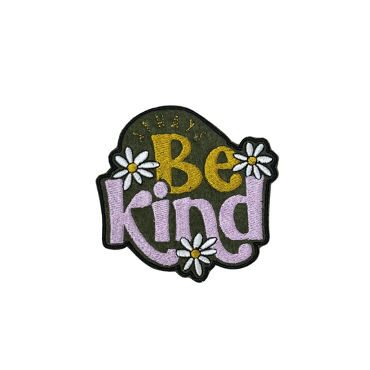 "Embroidered patch featuring the phrase 'Always Be Kind' in retro-style lettering, decorated with white daisy flowers on a green background."
