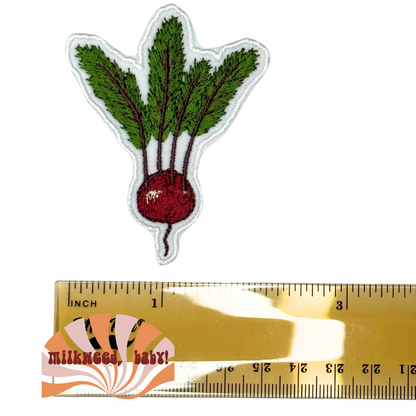 Beet patch beside ruler showing size in inches