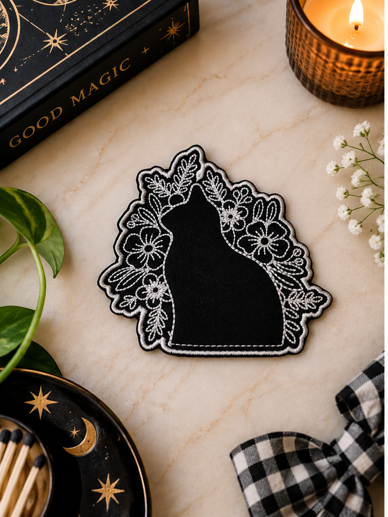 Black Cat Floral embroidered iron-on patch styled with witchy botanical accents
