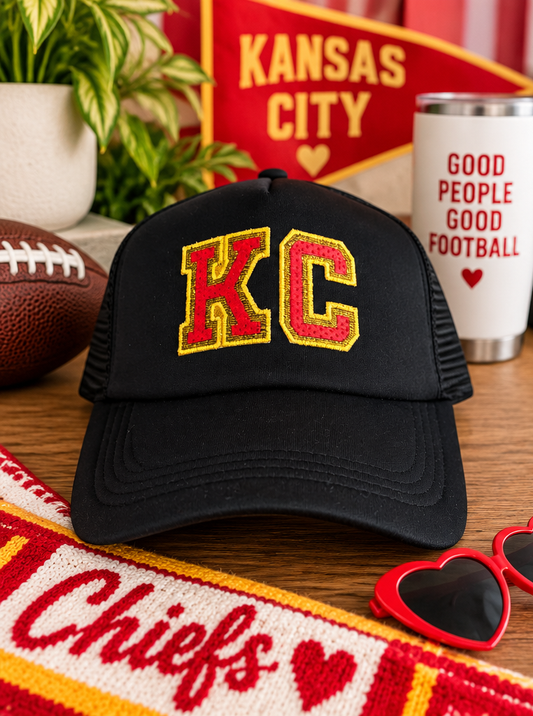Black KC trucker hat with red and gold embroidered KC patch