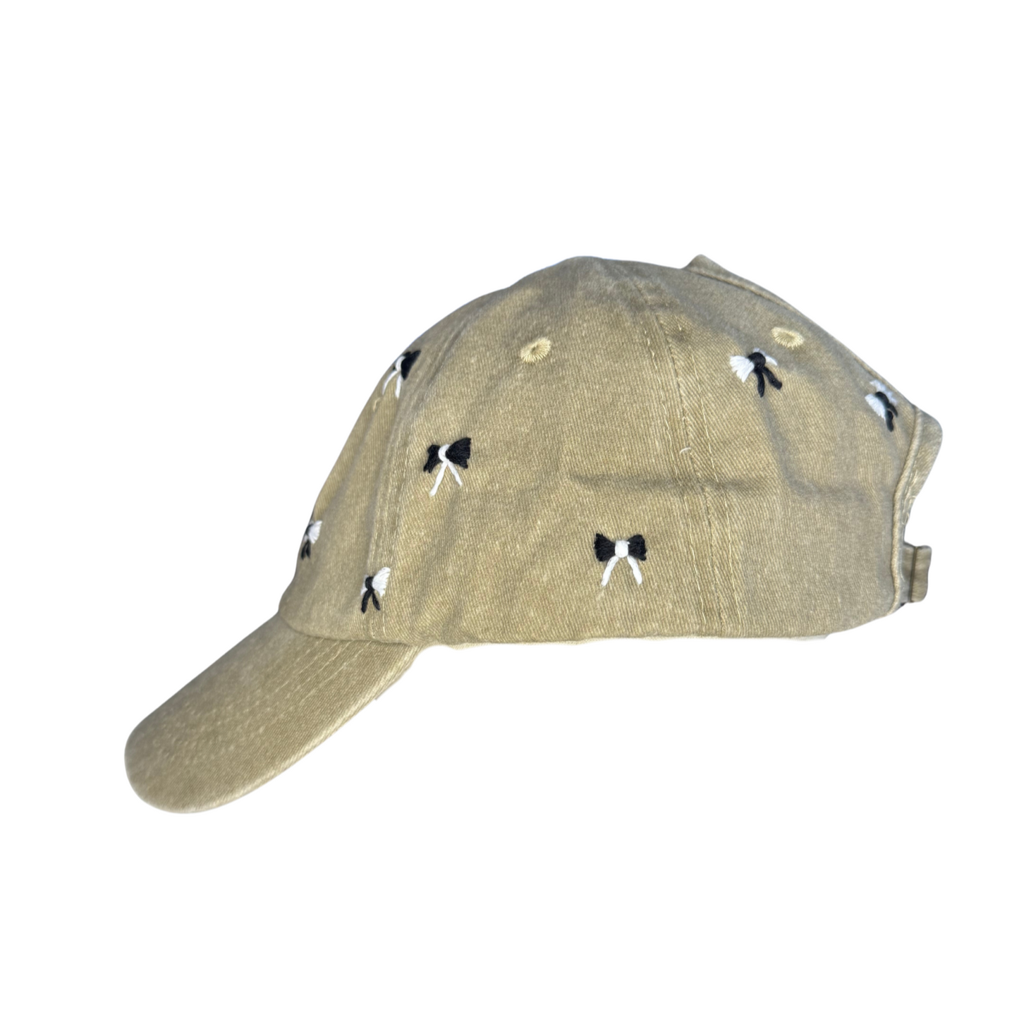Beige cap with black and white designs on a white background