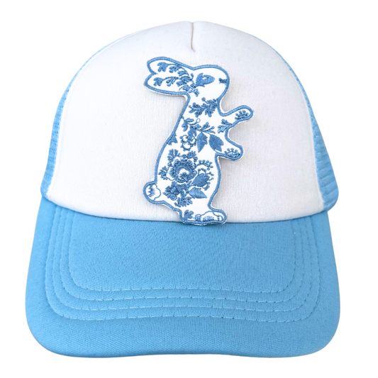 blue floral bunny embroidered patch ironed onto white and blue trucker hat

