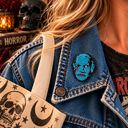 Blue retro zombie enamel pin worn on a denim jacket