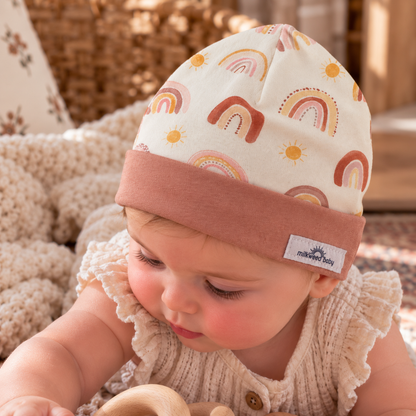 Baby wearing boho rainbow organic cotton beanie