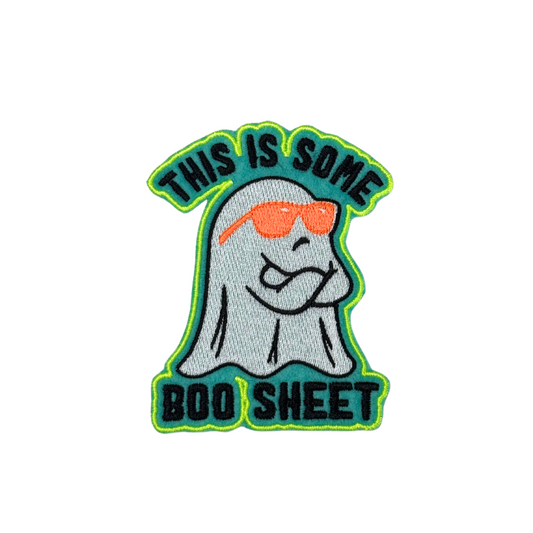 "This Is Some Boo Sheet embroidered iron-on patch featuring a ghost in sunglasses with neon green accents."

