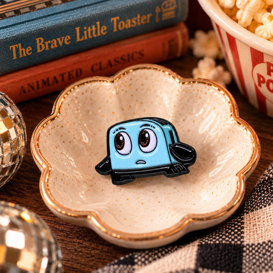 Brave Little Toaster enamel pin styled hero image