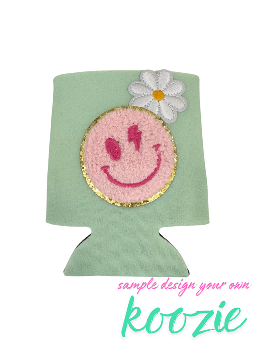 Customizable koozie with smiley face and flower design.