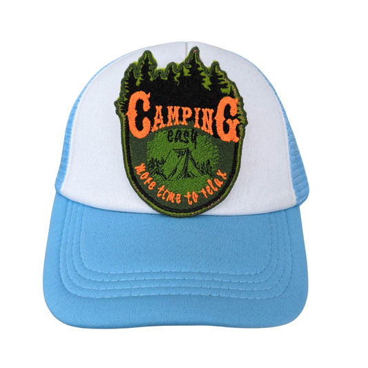 “camping iron-on patch displayed on white and blue trucker hat”
