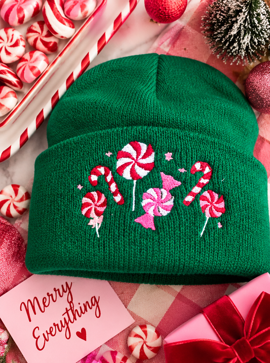 Green embroidered candy cane and peppermint Christmas beanie styled product photo
