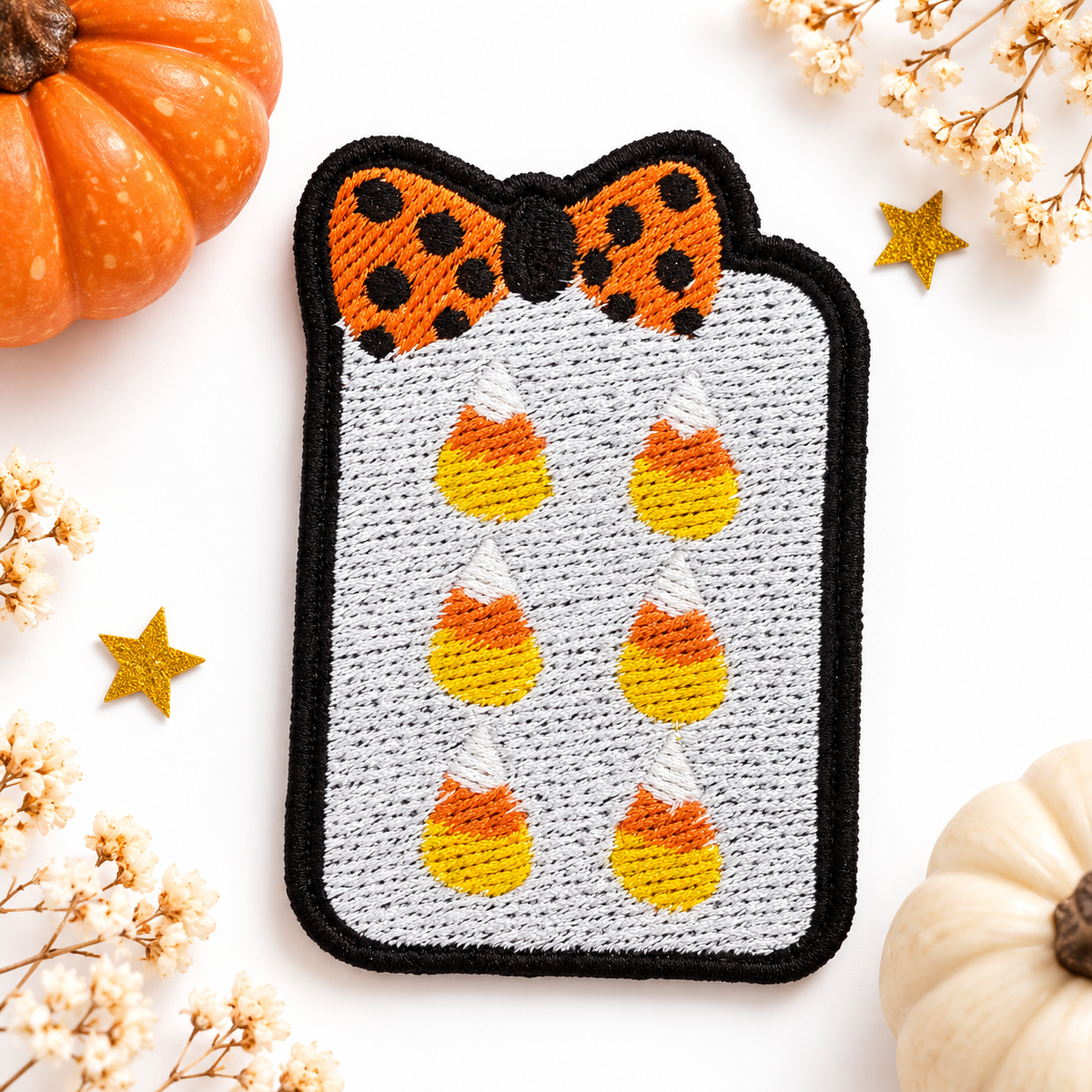 Candy corn mahjong tile embroidered patch on white studio background