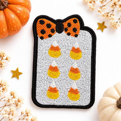 Candy corn mahjong tile embroidered patch on white studio background