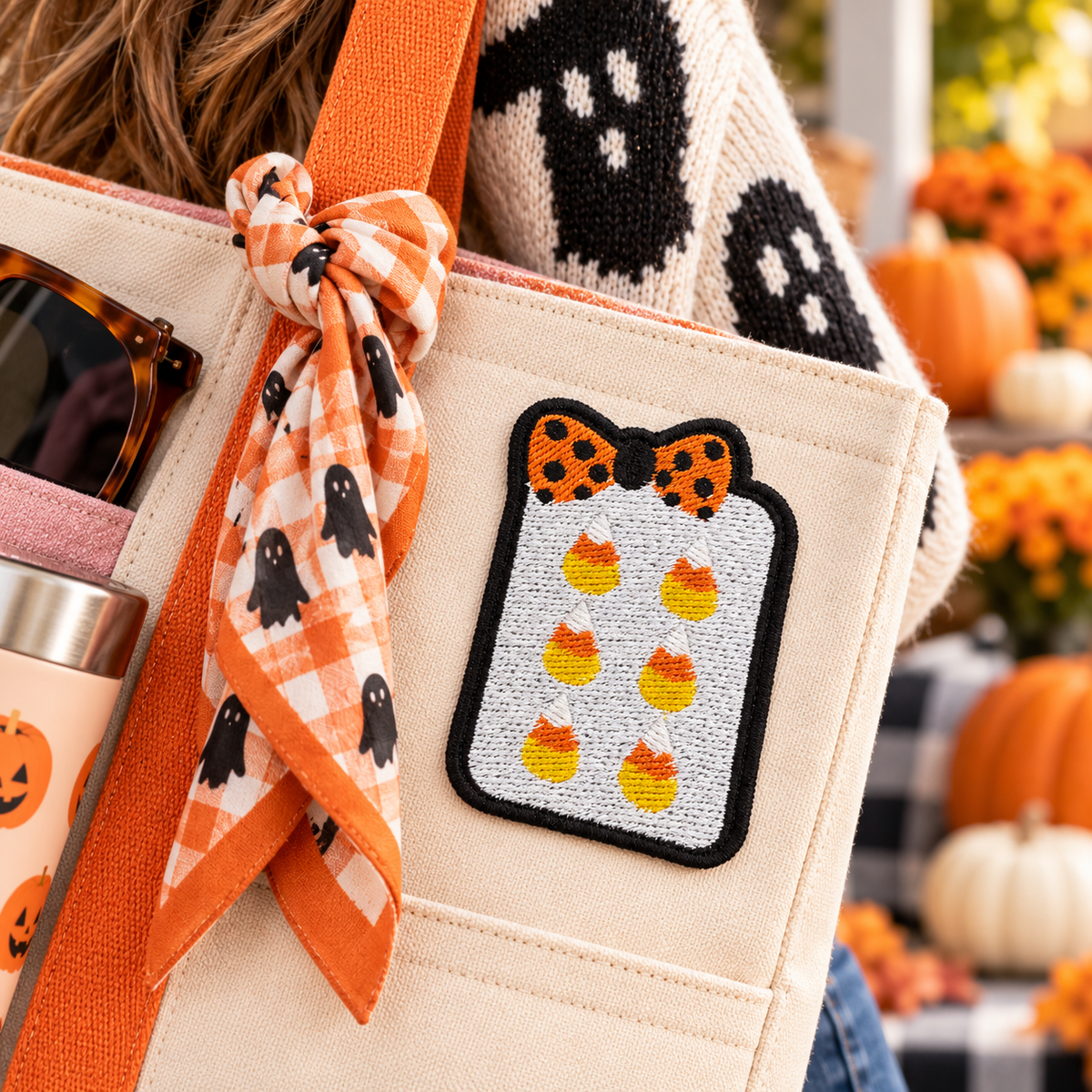 Candy corn mahjong tile embroidered patch on cream tote carried in autumn