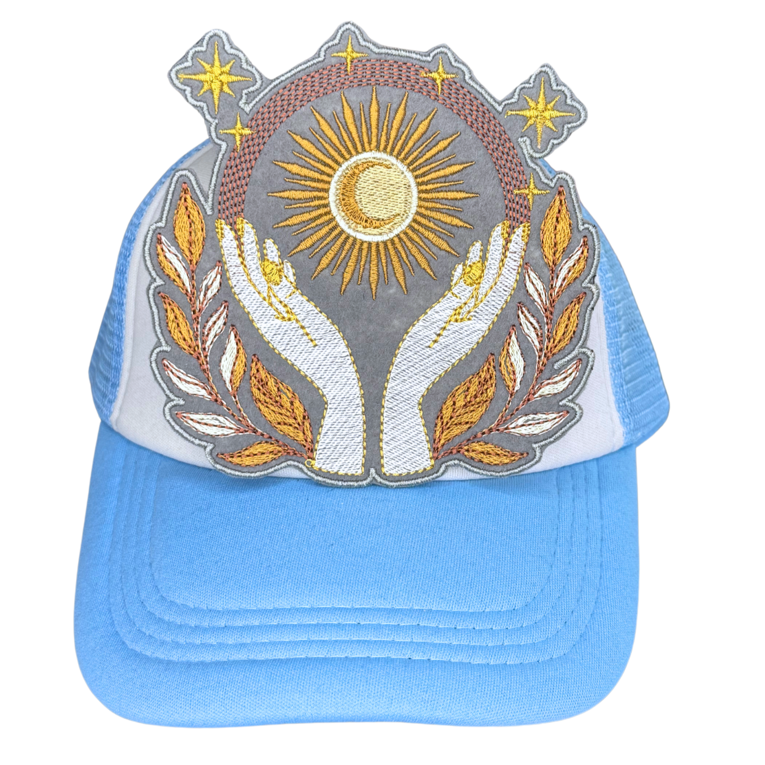 Embroidered patch with sun, hands, and stars ironed on blue and white hat

