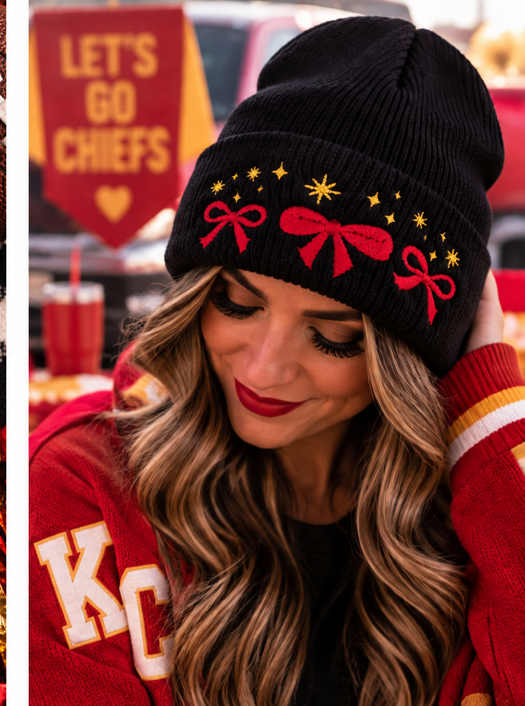 Woman wearing a black embroidered beanie with red bows and gold stars in a Kansas City game-day setting.