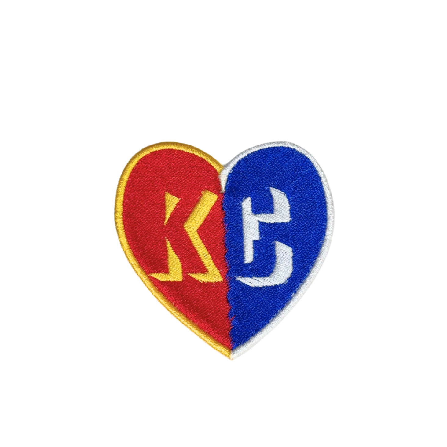 Flat lay of Kansas City heart embroidered patch in Chiefs and Royals colors

