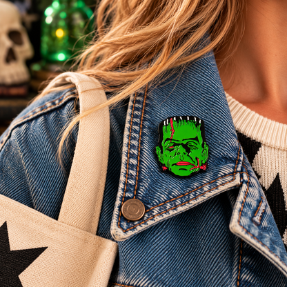 Classic green Frankenstein monster enamel pin worn on a denim jacket