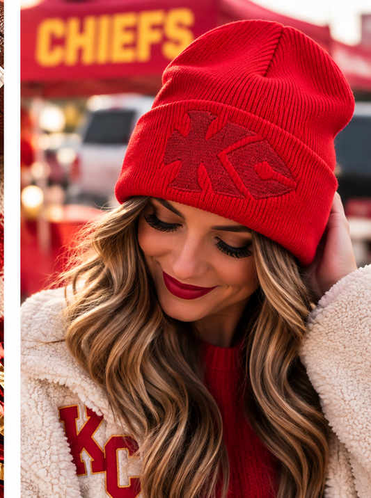 Classic red KC arrowhead embroidered beanie worn in a Kansas City game day setting
