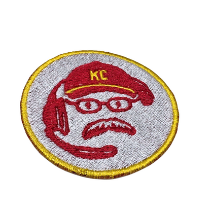 Close-up angle of the Coach Reid patch showing embroidery texture and colors
